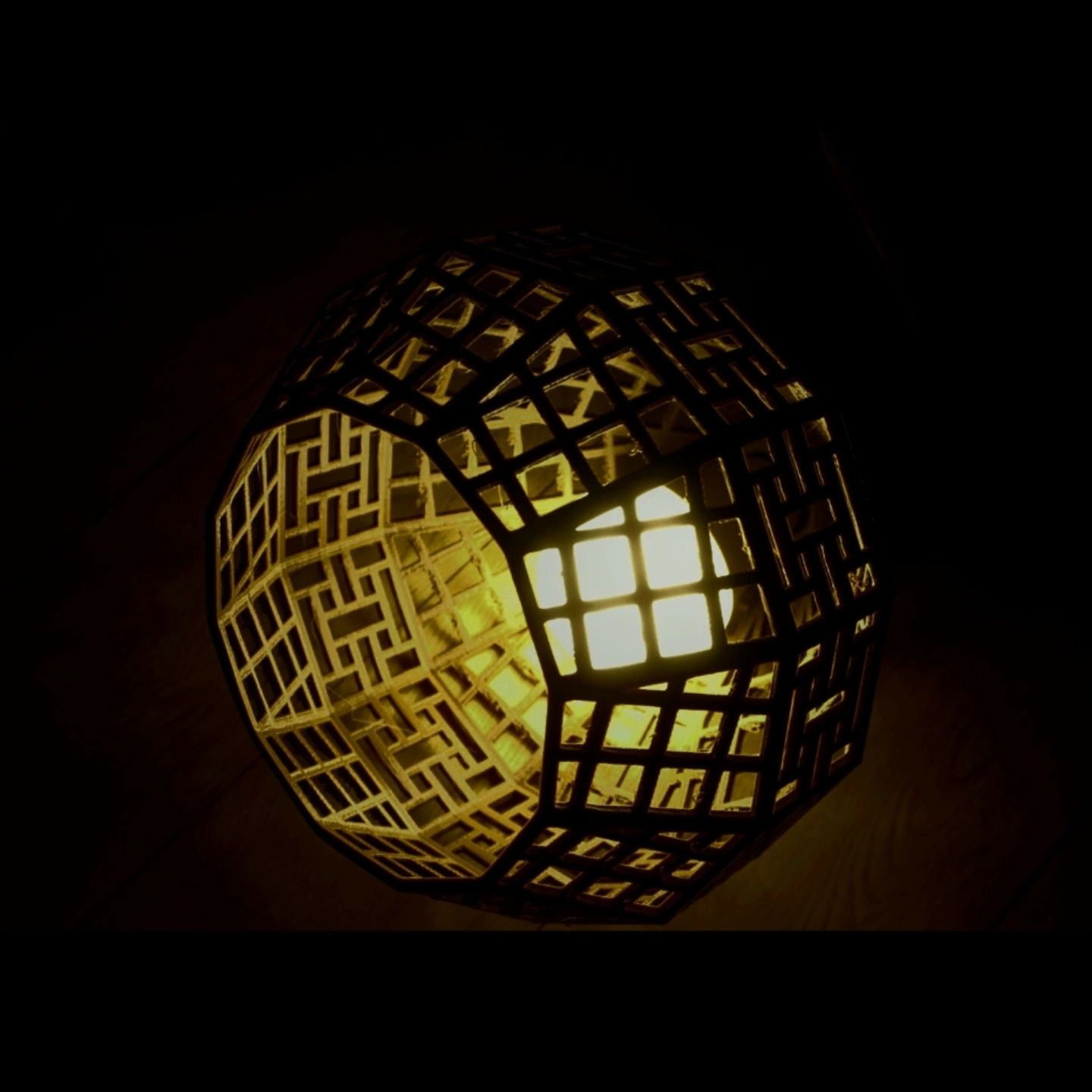 Window (2022): a warm glowing geometric lattice sculpture against a dark background
